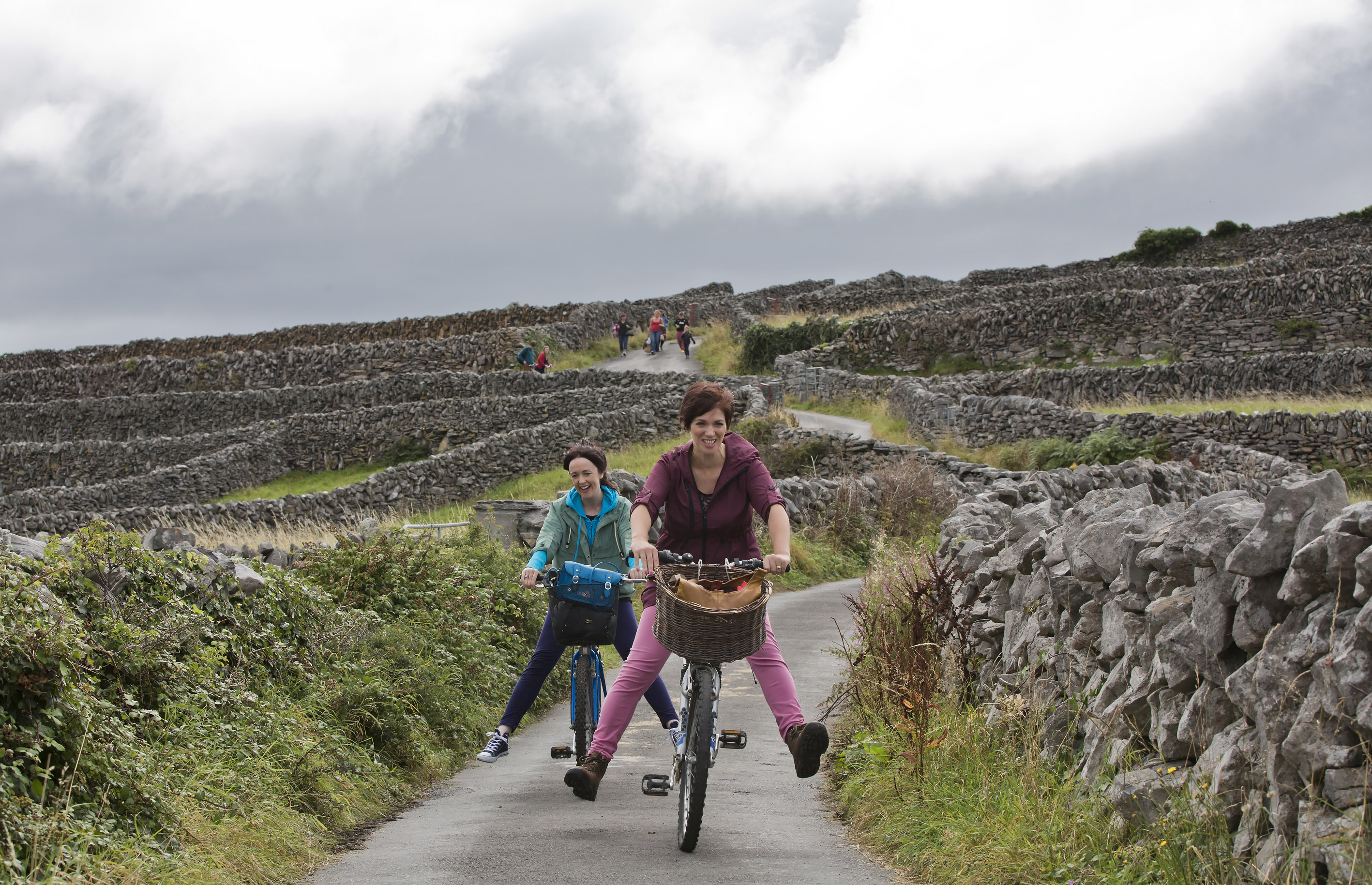 Two woman biking through hills, Inis Oirr