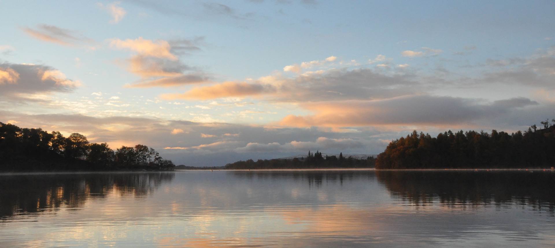 Loch Lomond at sunset, still water