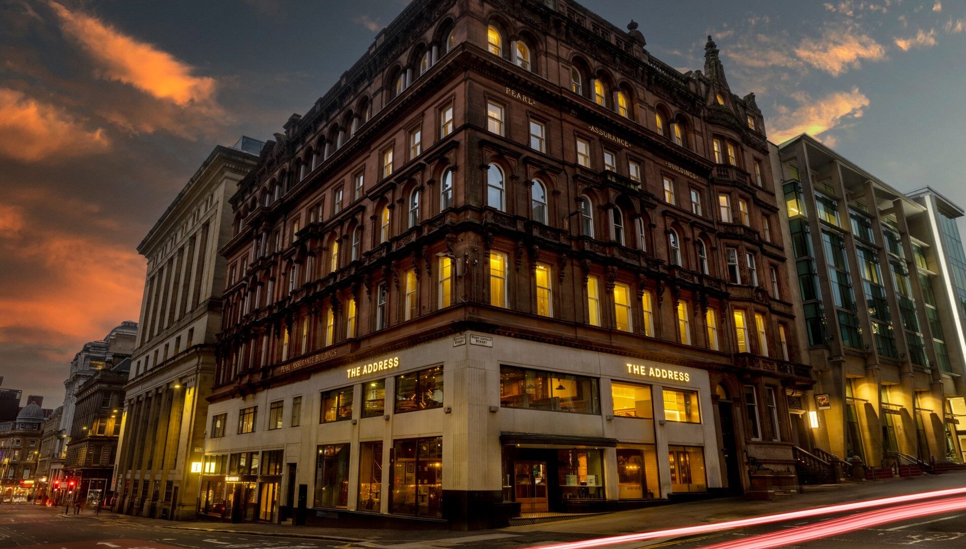 A very tall building sitting on the corner of a street