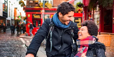 A couple walking down a street