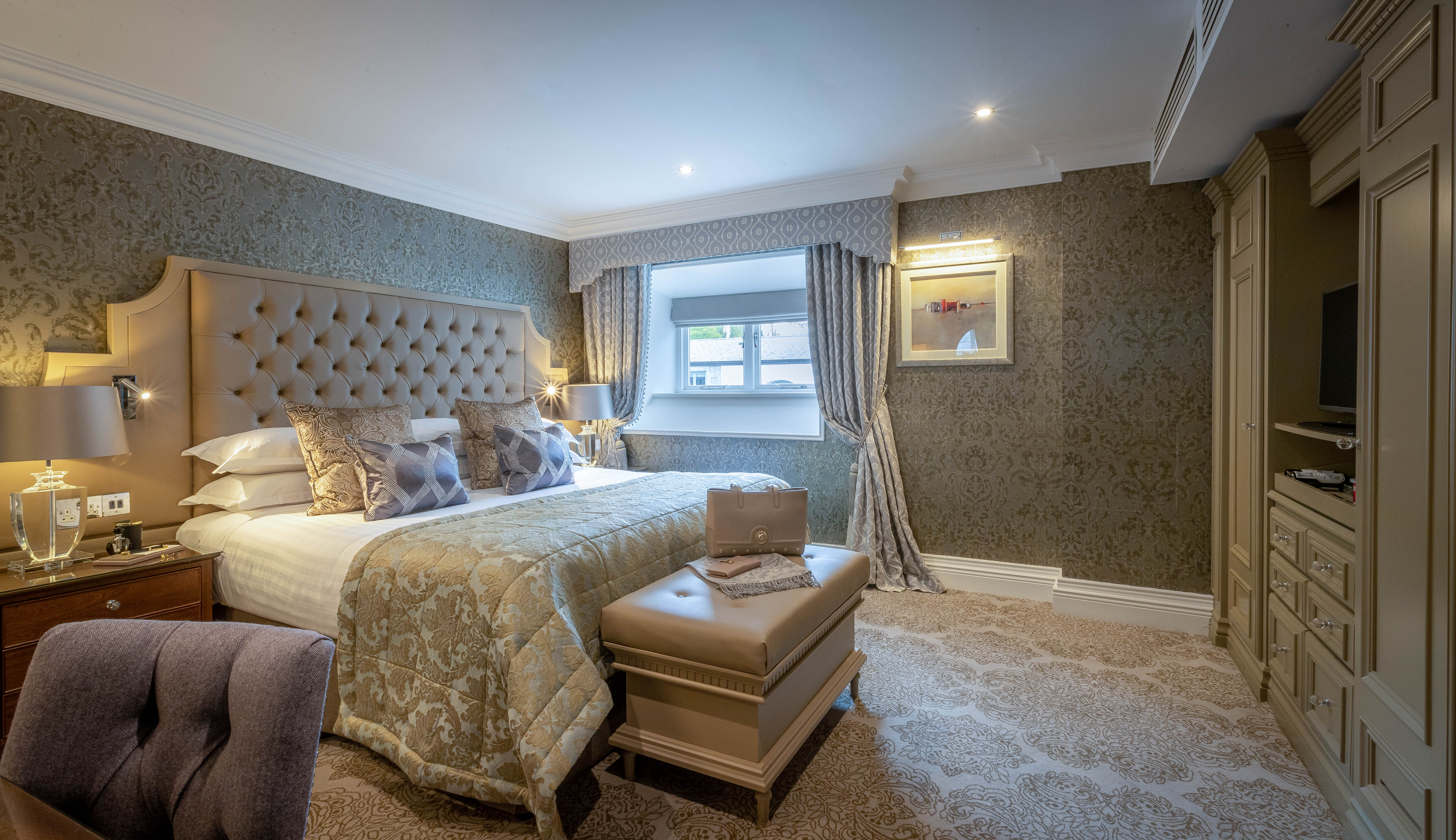 Deluxe room with large bed in Dromoland Castle