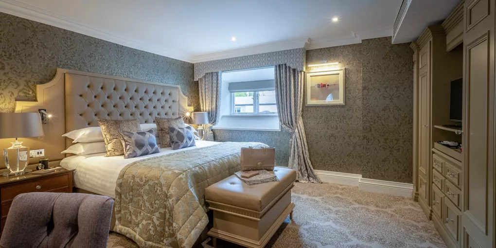 Deluxe room with large bed in Dromoland Castle