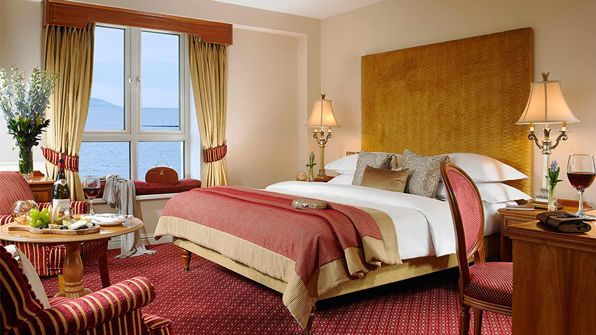 A bedroom with a large bed and a large window