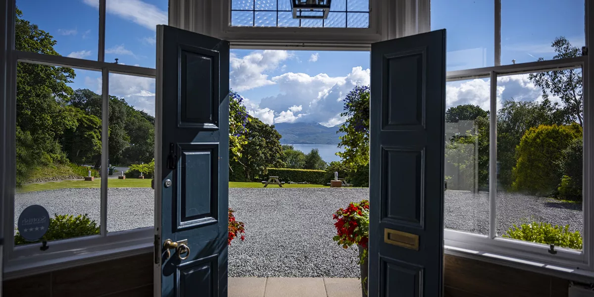 Entrance of Duisdale Hotel with lake view in Scotland