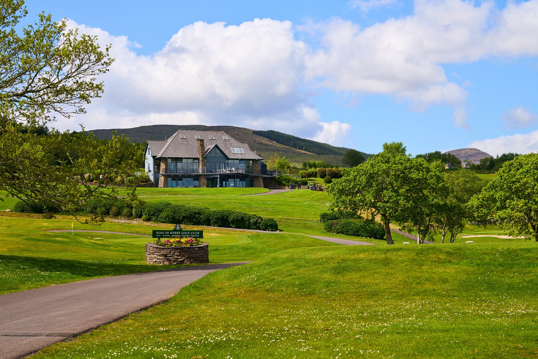 Exterior of sheen falls surrounded by green grounds