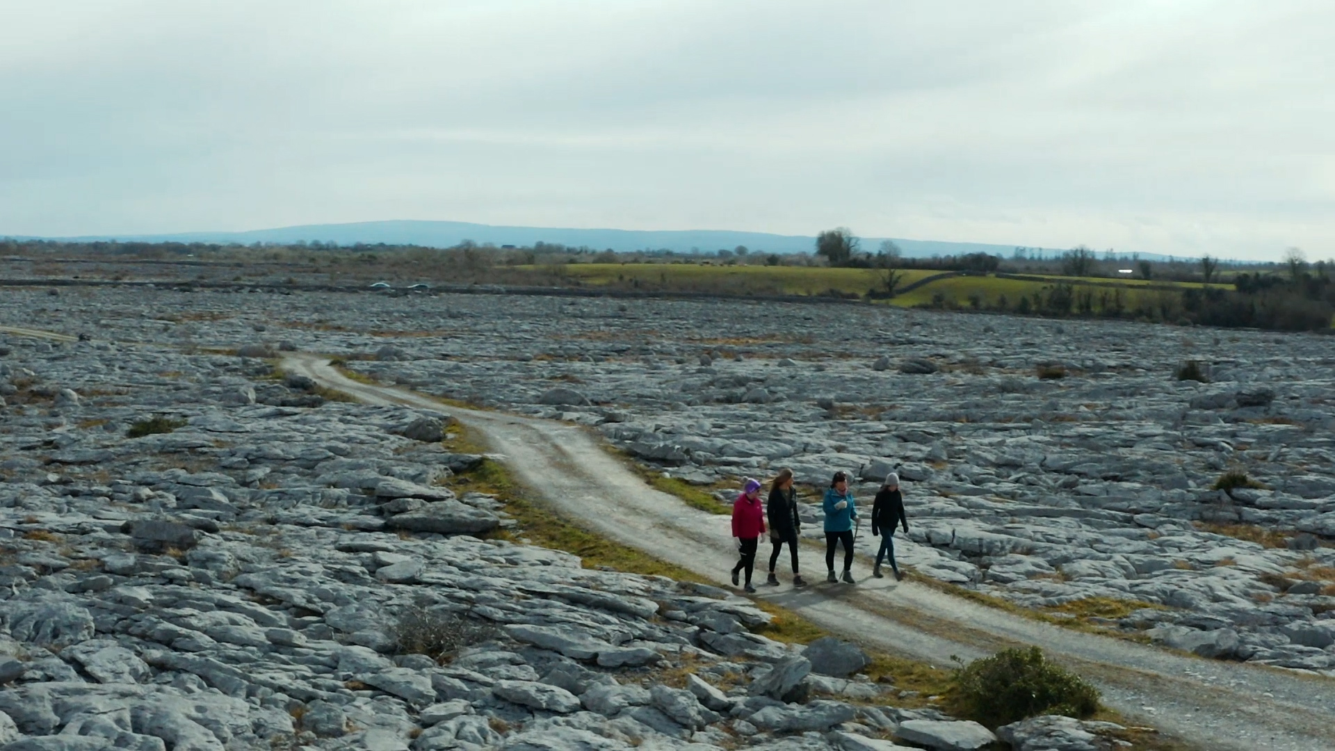 Travellers on Burren Walking Tour going through a rocky road