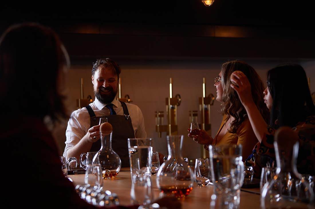 A group of people enjoying their whisky tasting experience