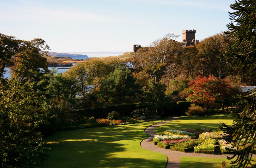 A view of a garden with a castle in the background