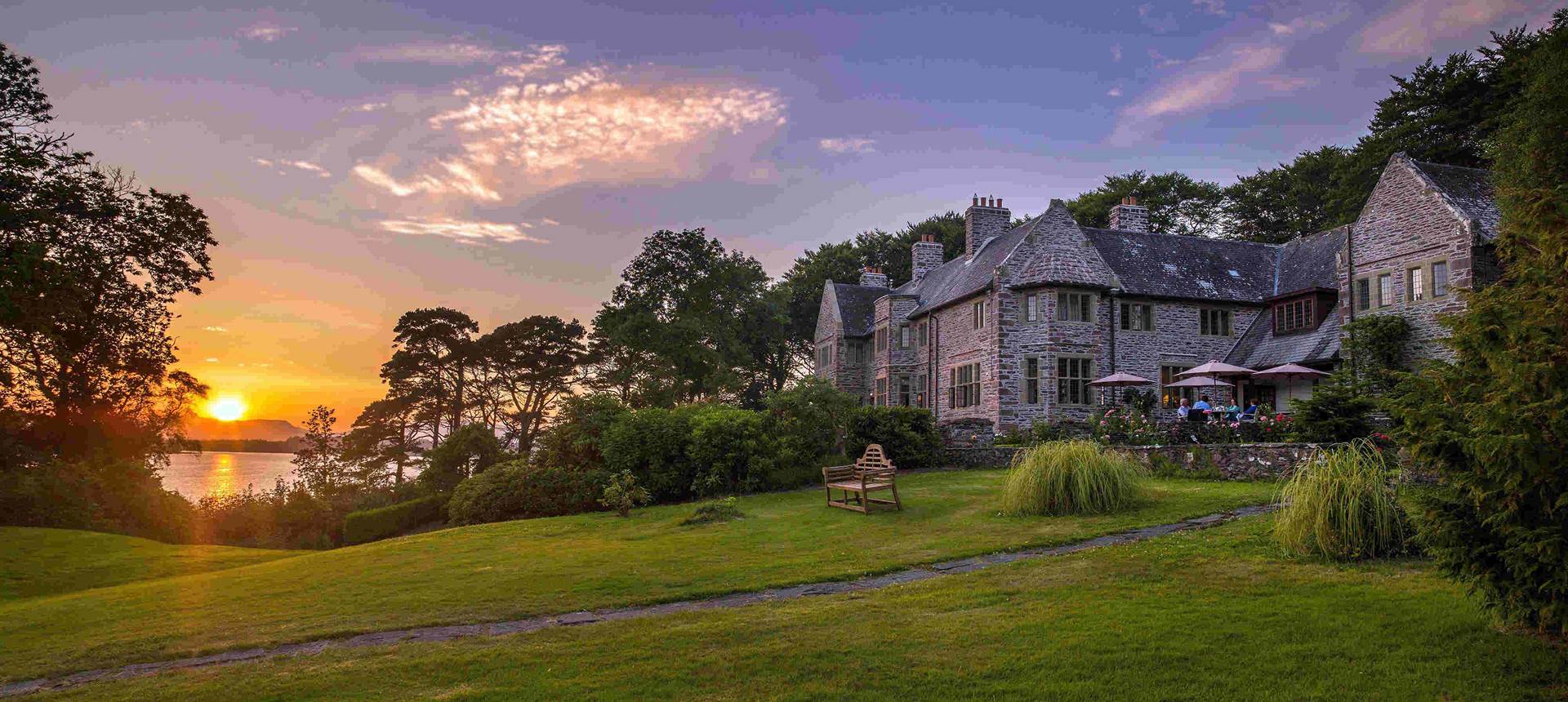 A large house sitting on top of a lush green field 