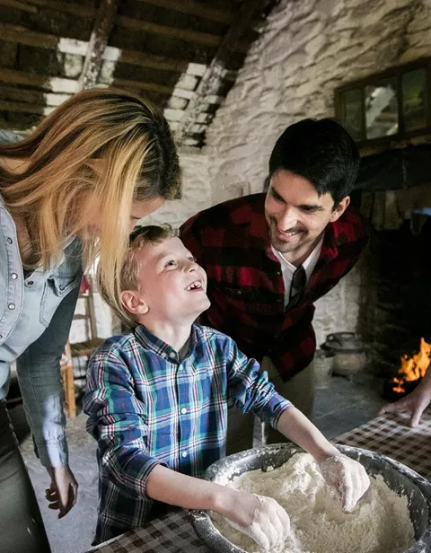 A family making bread on a farm in Killarney National Park