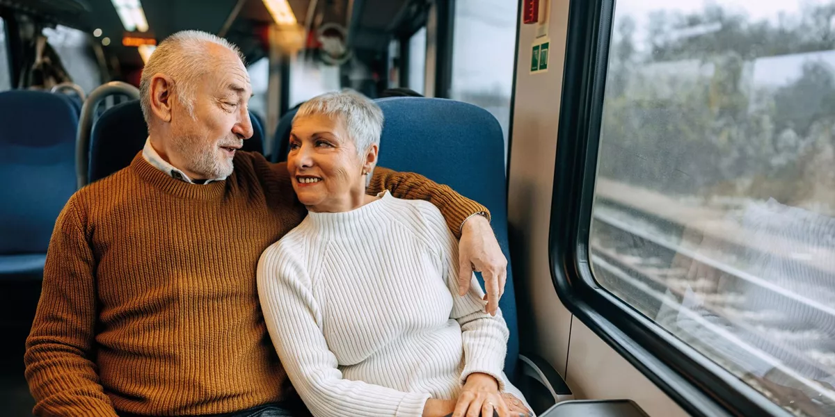 A couple travelling by train