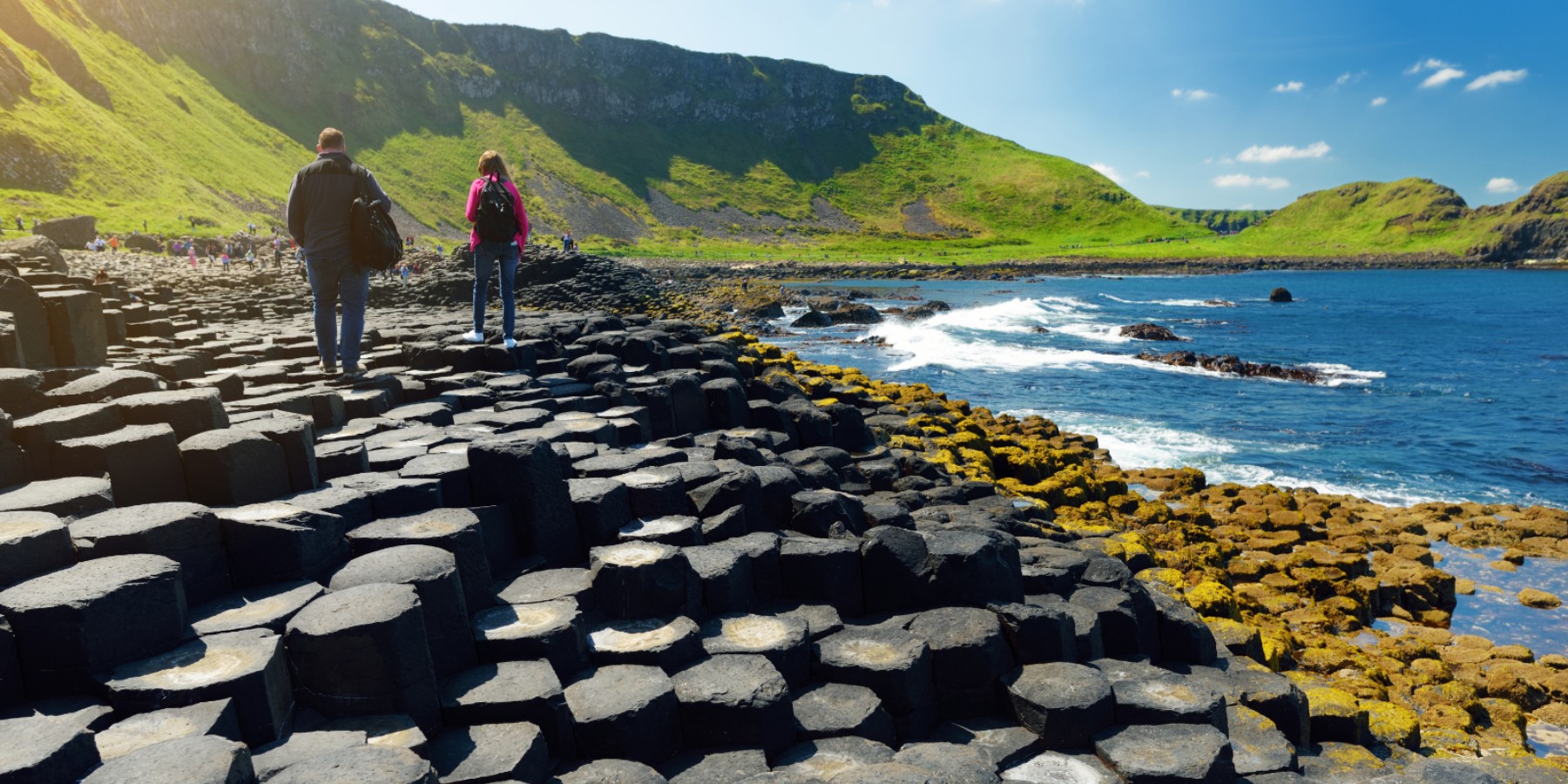 People walking along Giants Causeway