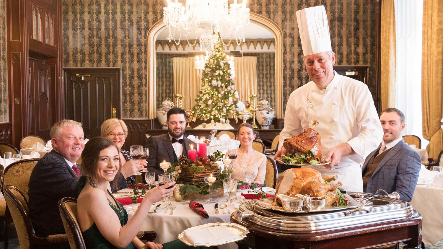 A group of people with chef celebrating Thanksgiving at Dromoland Castle