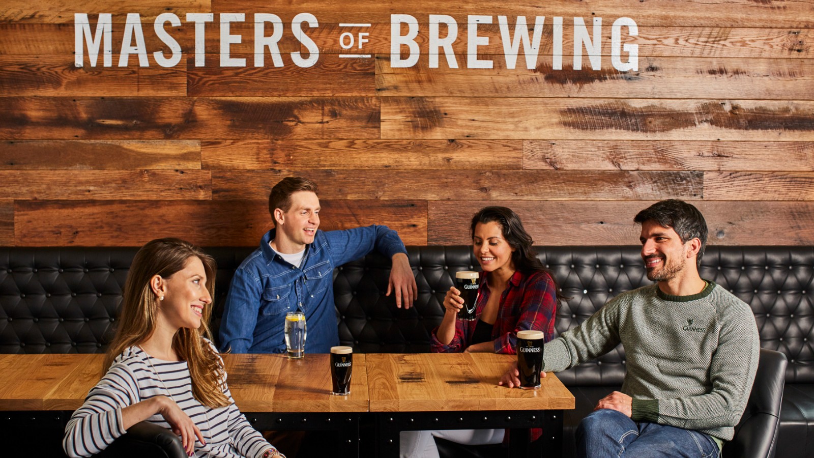 Guests tasting Guinness in a wooden lounge