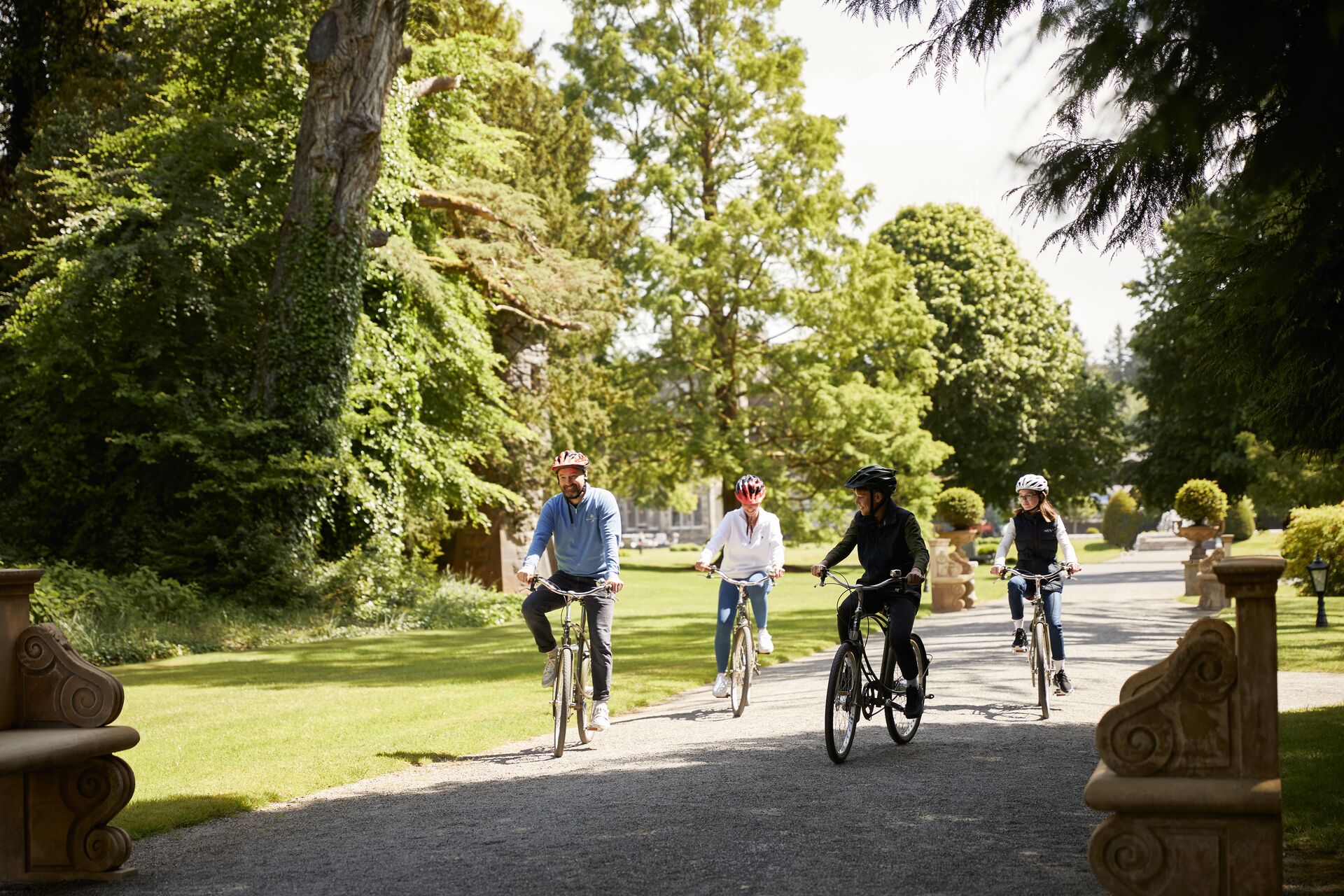 Family cycling around Ashford Castle
