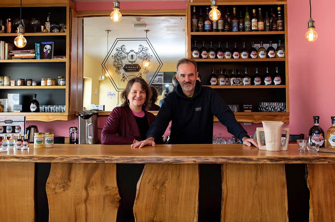 Two people behind the bar at Kinsale Meadery