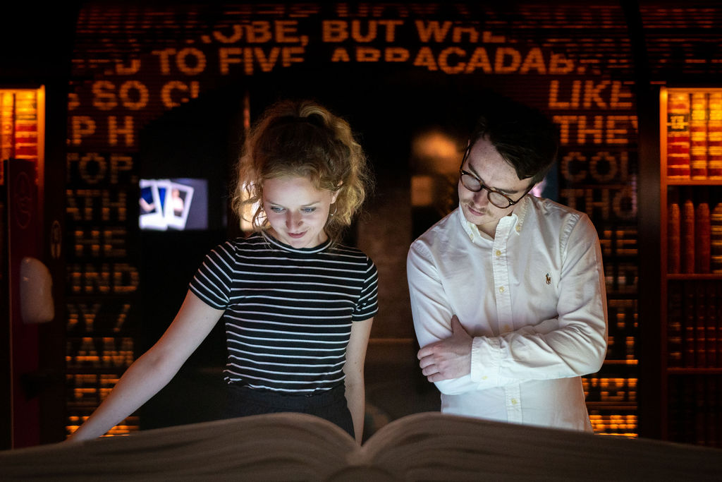 Two people reading a book in EPIC Irish Emigration Museum