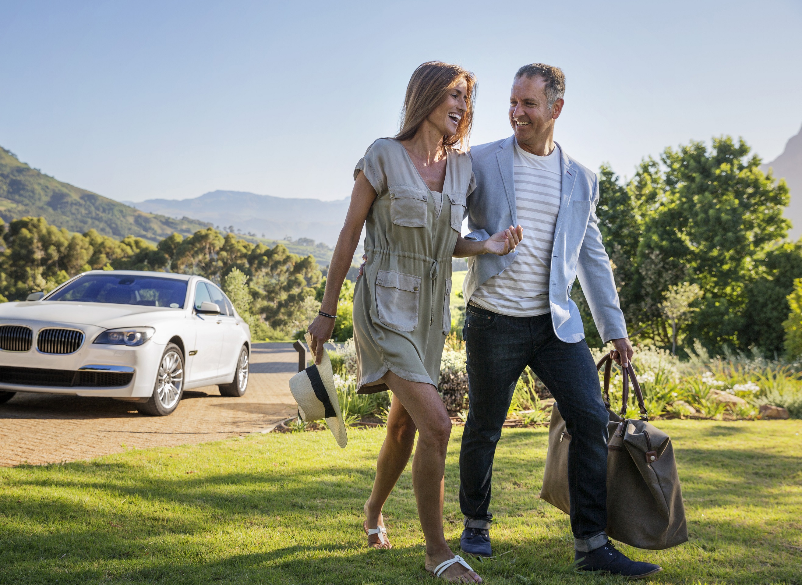 Lux Self Drive Confident Couple Arriving At Home