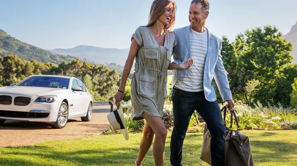 Lux Self Drive Confident Couple Arriving At Home