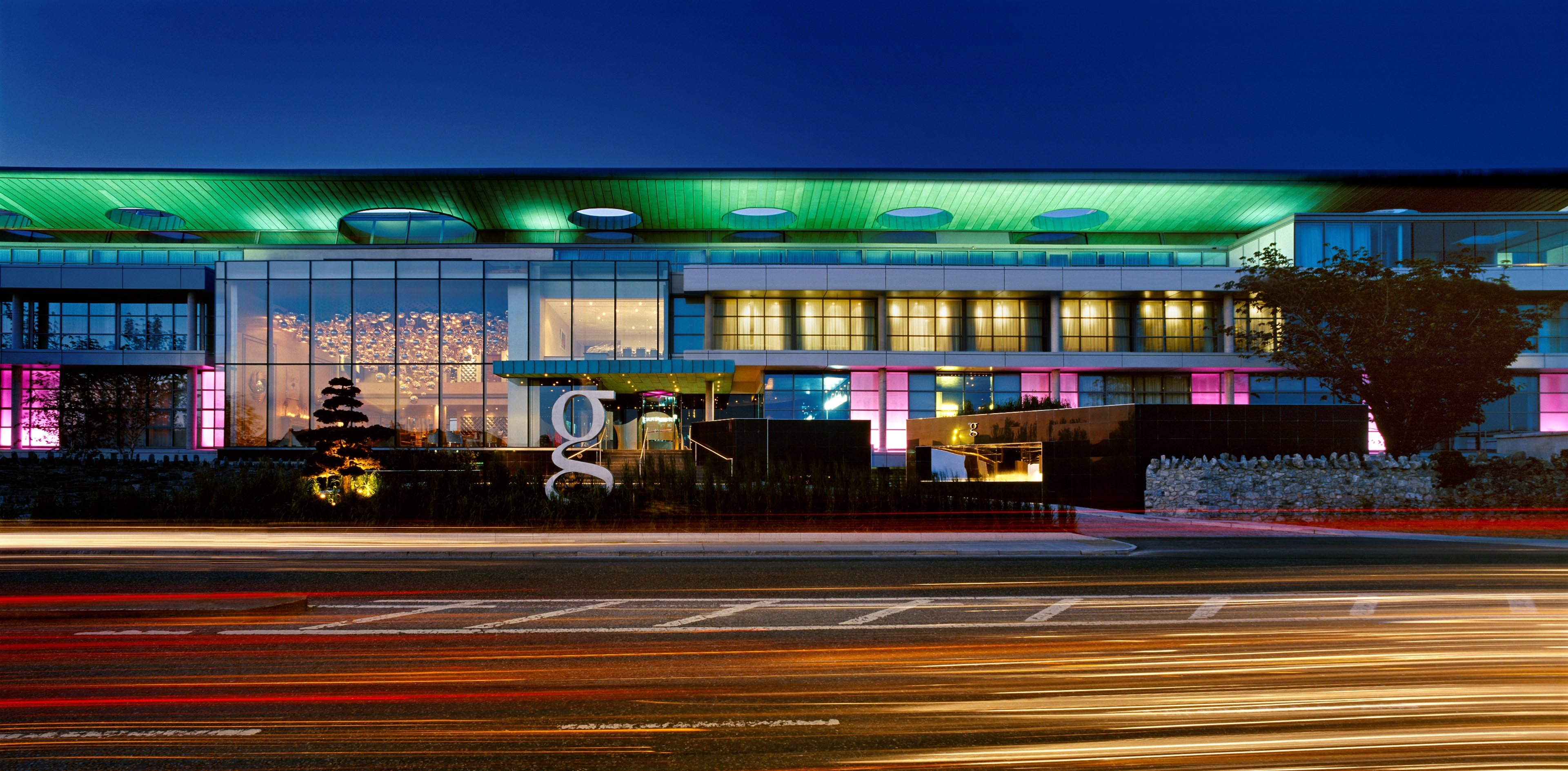 Exterior of The G Hotel in Galway by night