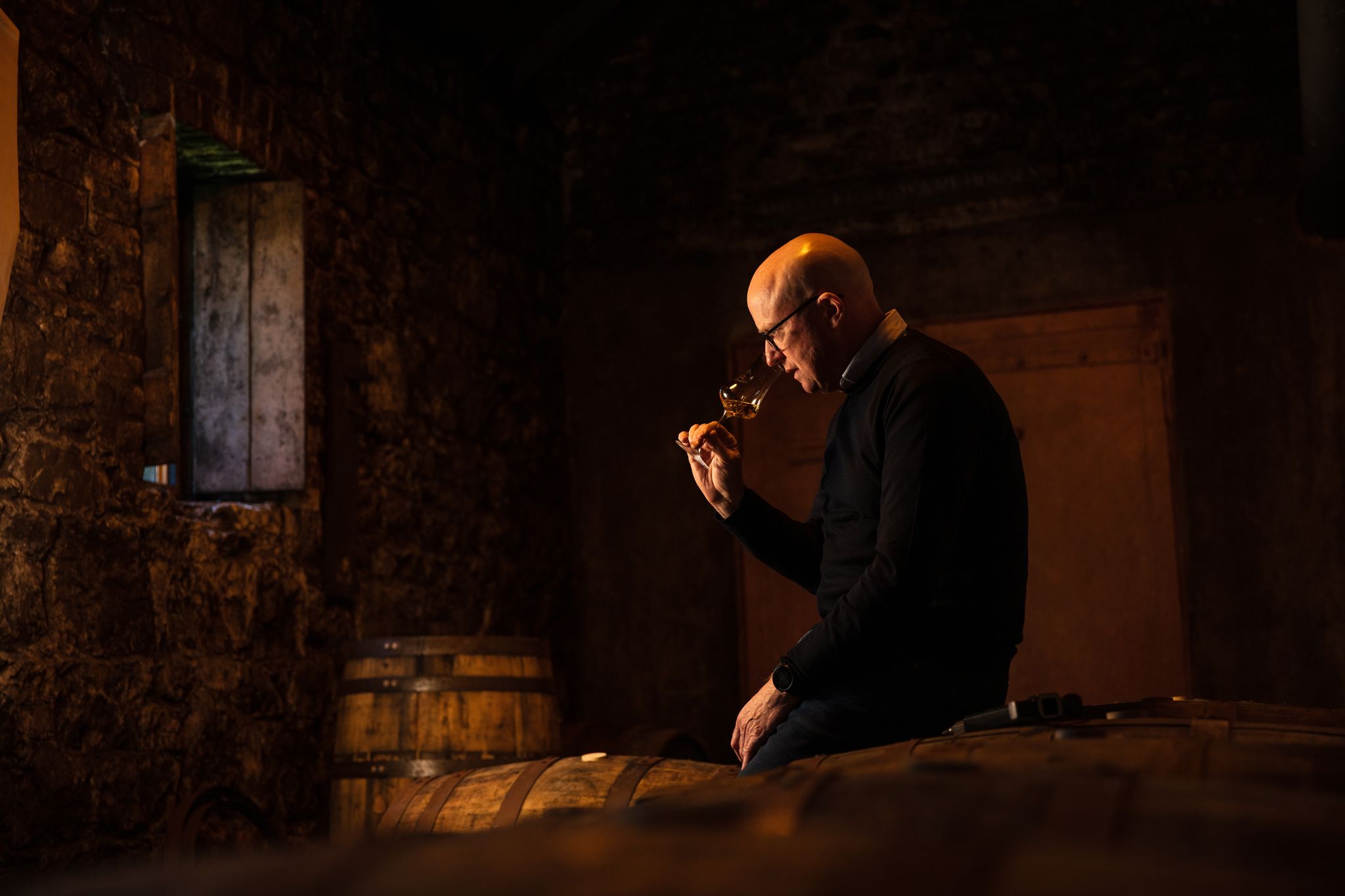 Distiller with cask on Jameson Experience Midleton tour