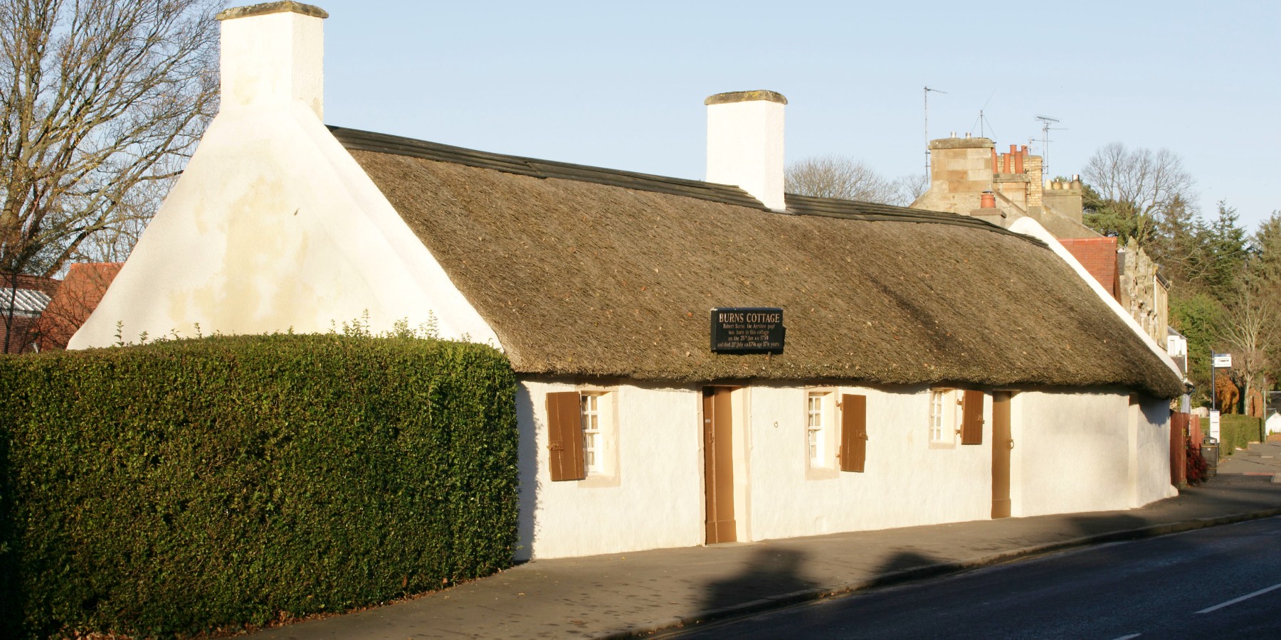 A thatched roof bungalow