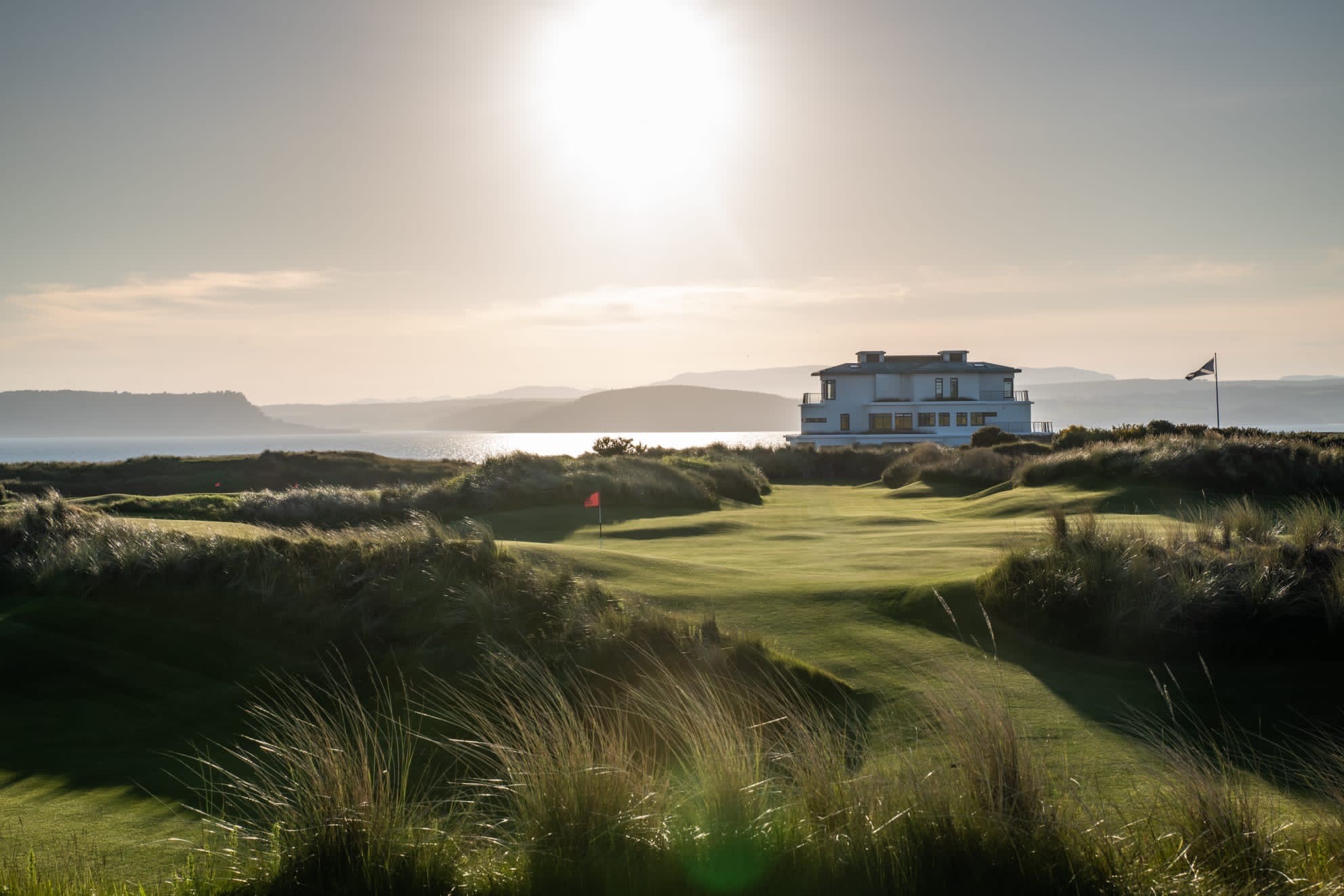 A house on a golf course near the ocean