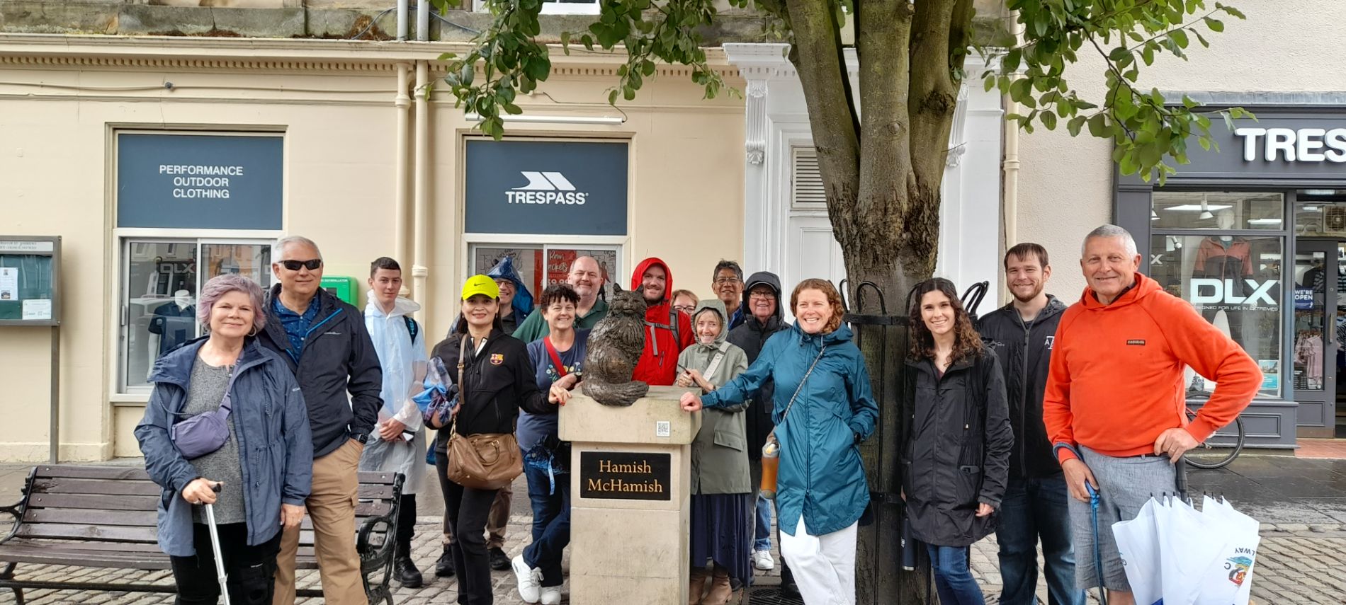 Group of people near tree And Hamish Mc Hamish statue