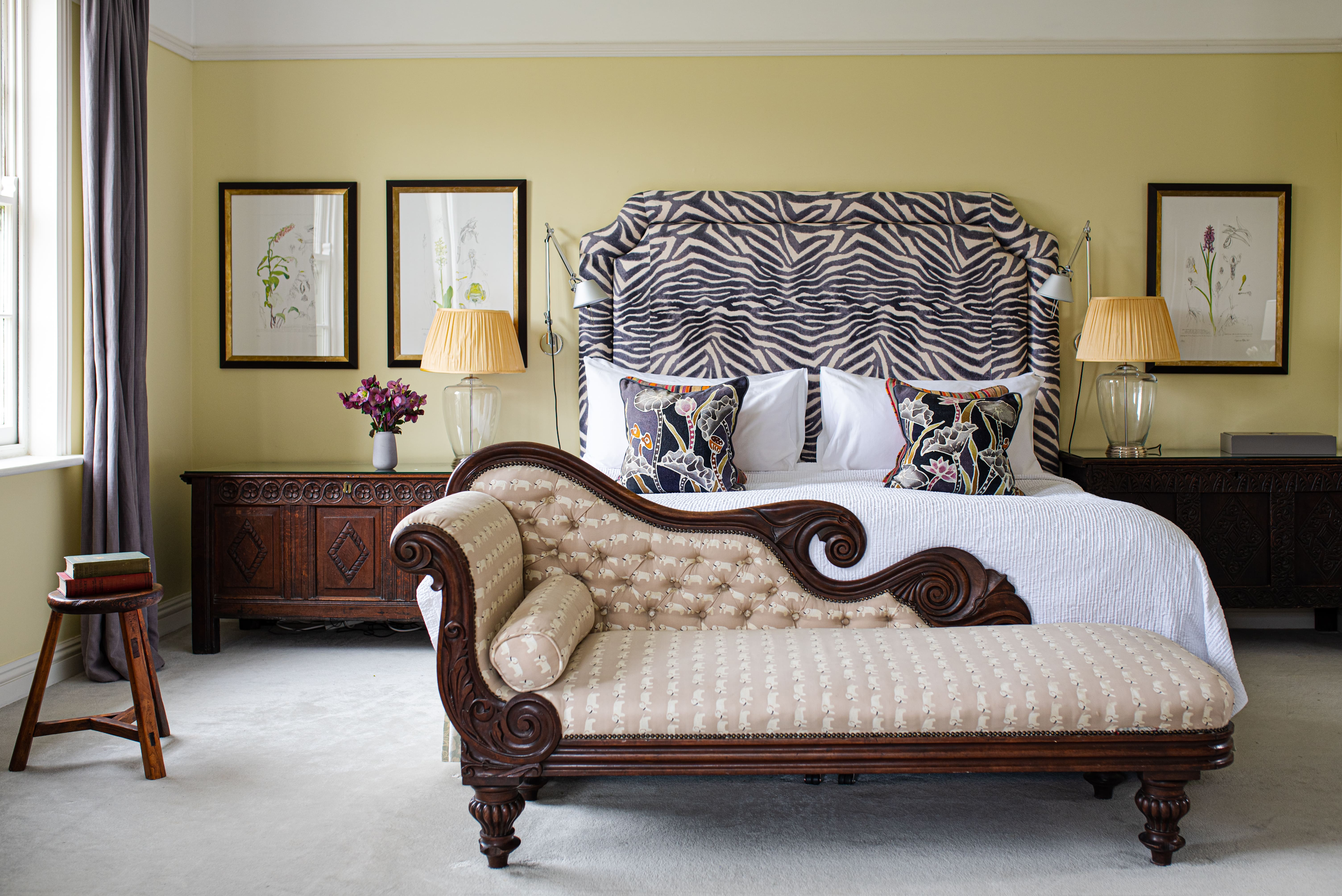  A bed with a zebra print headboard and foot board in Gregans Castle Hotel in Clare 