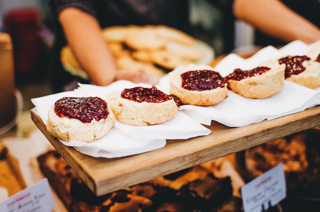A wooden table topped with pastries 
