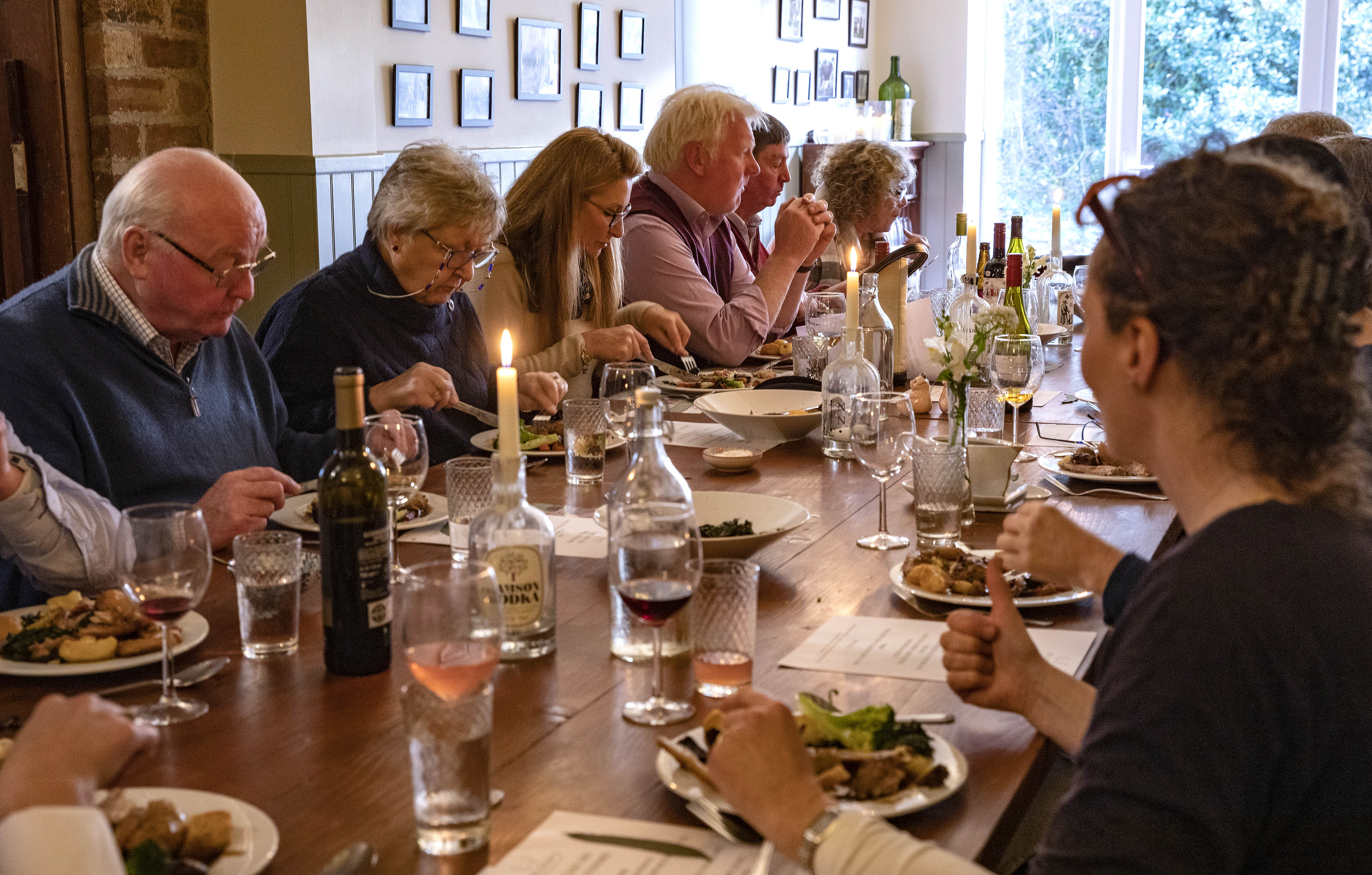 A group of people dining at a long table